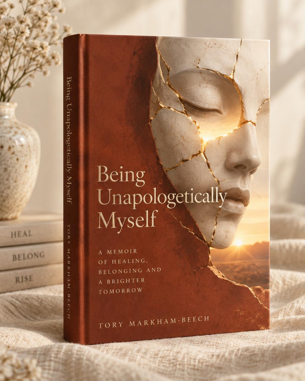 Cover of Being Unapologetically Myself: a cracked mask with golden seams and dawn light